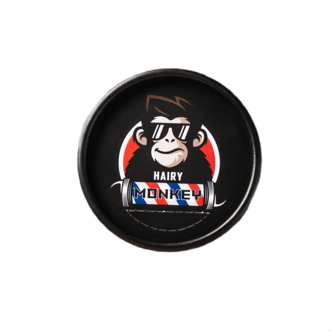 Top view of Hairy Monkey Razor Blades container for professional barbers